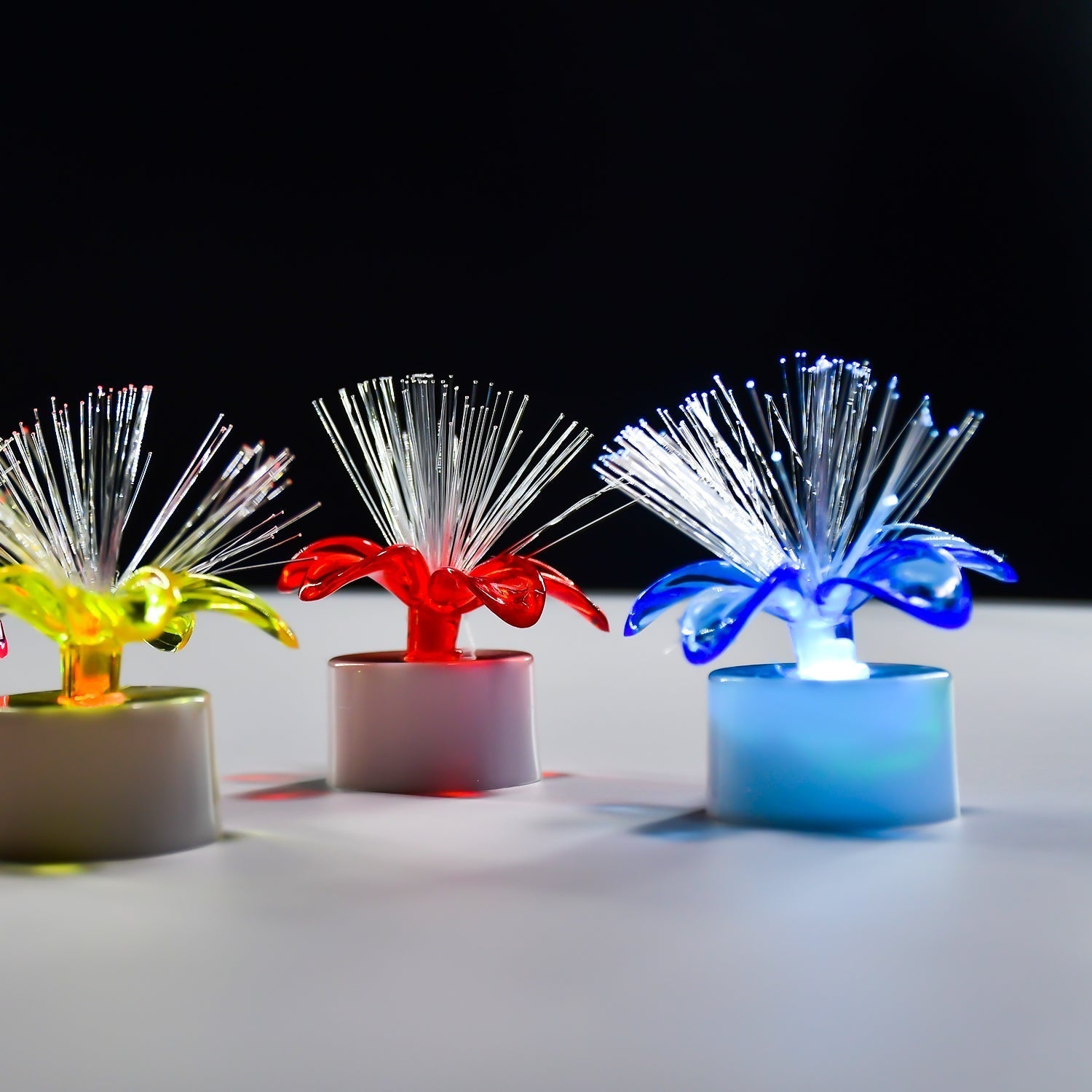 Color-changing LED table centerpiece with fiber optic light. Color-changing LED table centerpiece with fiber optic light.